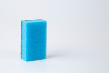 Colored sponges for washing dishes on a white background.