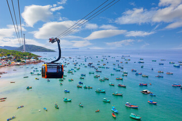 Hanging cabin on the Phu Quoc cable car to Hon Thom Island above azure sea. Top view of Vietnamese...
