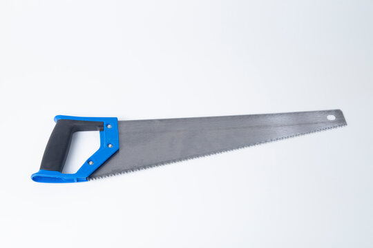 Hand saw for cutting wood on a white background.