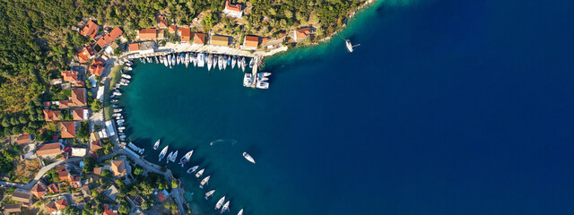 Aerial drone ultra wide photo of picturesque beautiful seaside village of Kioni a safe anchorage...