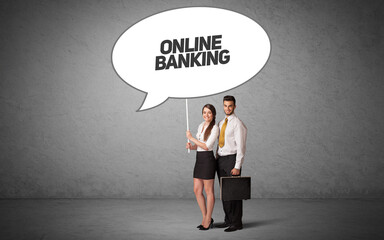 Young business person in casual holding road sign with ONLINE BANKING inscription, new business idea concept