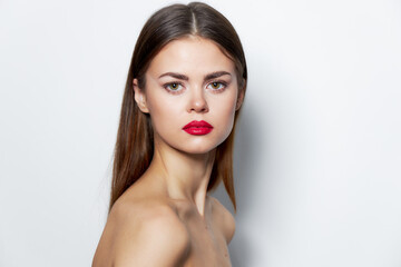 Fototapeta premium Woman Bare shoulders long hair spa treatments red lips light 