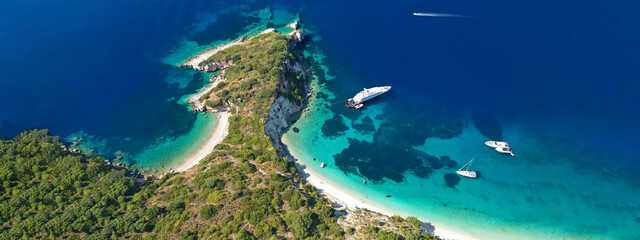Fototapeta premium Aerial drone top down ultra wide photo of luxury yacht anchored in tropical exotic island turquoise sea