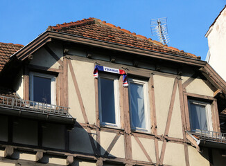 french tricolored scarf on house facade