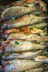 summer garden party with grilled fish and herbs, grilled trout