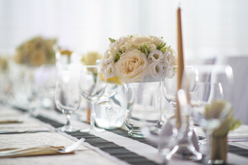 wedding table with flowers and decorations, wedding centerpiece or event reception in modern style