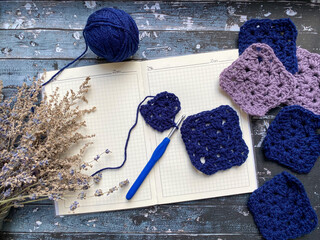 Crochet pieces on a blank notebook