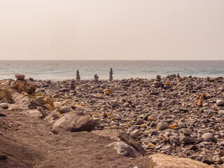 Pebble towers on stoney beach at Costa Adeje, Teneriffe, Canary Islands, Spain