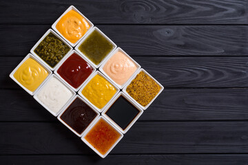 Set of different sauces in ceramic bowl