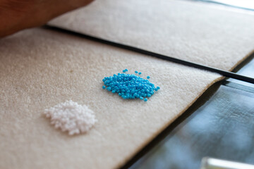 woman hands making beaded jewelry