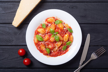 Italian homemade potatoes gnocchi with tomatoes sauce