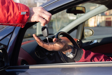 Fototapeta na wymiar Buying a car, handing over the ignition key