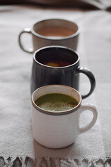 Three cup of cocoa with coconut milk. Concept of cosy winter holidays drink