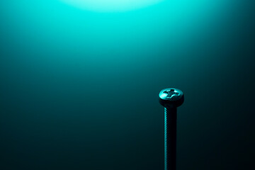 screw on a blue background