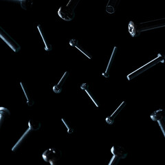 screws on a black background