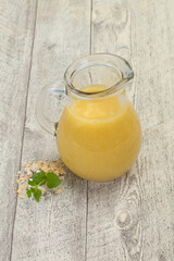 Dietary vegetarian oats milk over wooden