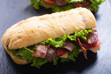 sandwich with lattuce beef cheese and tomato