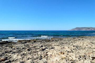 The rocky beach of Cala Pozzo in the west part of the little island of Favignana, near Sicily in the Mediterranean sea