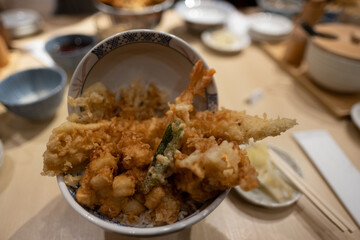 Fresh fried tempura exploding from bowl, Osaka, Japan, december 16, 2018