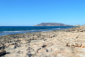 The rocky beach of Cala Pozzo in the west part of the little island of Favignana, near Sicily in the Mediterranean sea