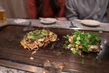 Okonomiyaki, Scallion on noodles, Osaka, Japan, december 17, 2018