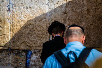 orthodox jews at the wailing wall in jerusalem