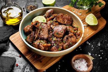 Fried chicken liver with onions and herbs. 