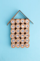 handmade advent calendar craft, DIY, step 4, top view, blue background