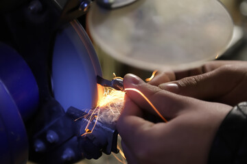 mechanic at work with grinder