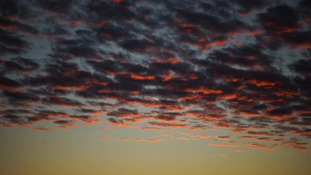 Red purple orange blue pink sunset sky clouds  timelapse for the background 