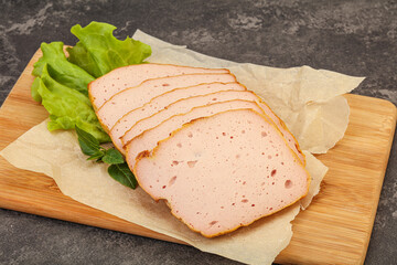 Boiled pork sausage over board