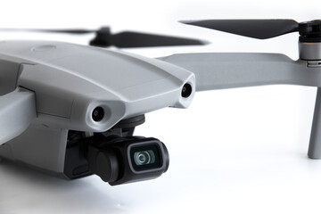 Close-up of a drone camera on a white background.