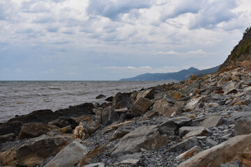 Fototapeta na wymiar stone beach with sea view