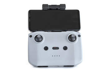 Quadcopter remote control with phone on white background