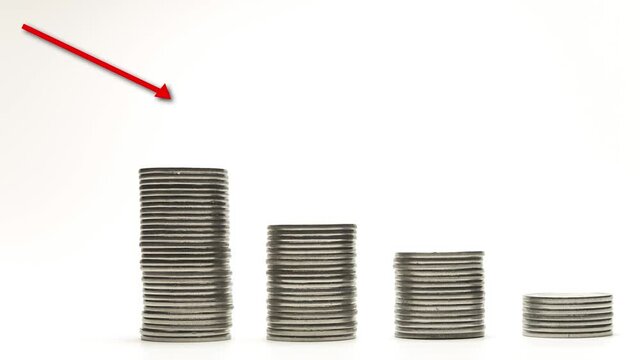 Silver coins on stacks are decrease with red arrow on white background stop motion animation
