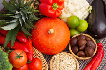 Group vegetables and Fruits Apples, grapes, oranges, and bananas in the wooden basket with carrots,...