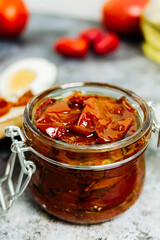 sun-dried tomatoes with olive oil in a jar