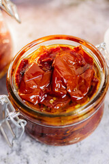 sun-dried tomatoes with olive oil in a jar