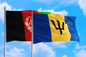 Barbados and Afghanistan national flag waving in the wind on a deep blue sky together. High quality fabric. International relations concept.
