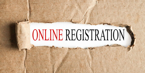 ONLINE REGISTRATION, text on white paper on torn paper background