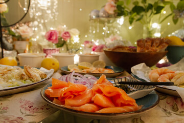 Gourmet smoked salmon, crab salad, and prawns on a romantic table setting