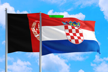 Naklejka premium Croatia and Afghanistan national flag waving in the wind on a deep blue sky together. High quality fabric. International relations concept.