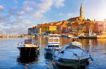 Rovinj, Rovigno, Istria, Croatia. Panoramic view at Romantic old town at Adriatic sea. Boats and yachts in harbor at magical summer sunrise with blue sky. Morning in Europe.