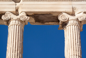 Two columns of the Ionic order against a blue sky