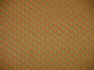 Abstract textured pattern in the chair upholstery orange brown color