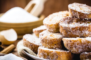 Bread dessert known as gold slice, lamb slice, french toast, Eggy bread, french toast, “Pain Perdu”. Around ingredients, like sugar and egg