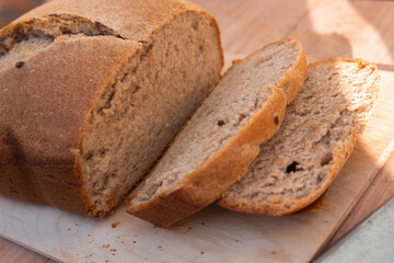homemade freshly baked whole grain bread with flax seeds in a bread maker.