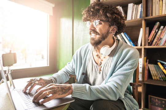 Hipster man having a video conference with important creative brand -  Concept of diversity and creativity