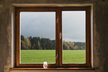 Old wooden window in the room with repair