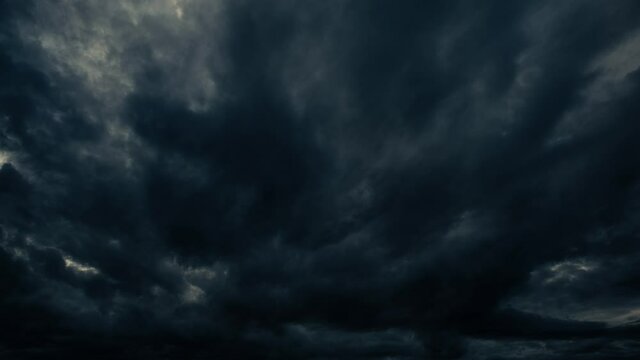 Cloudy storm clouds float on the sky. Tinted image. The accelerated video. There is a small movement and rocking of the camera.